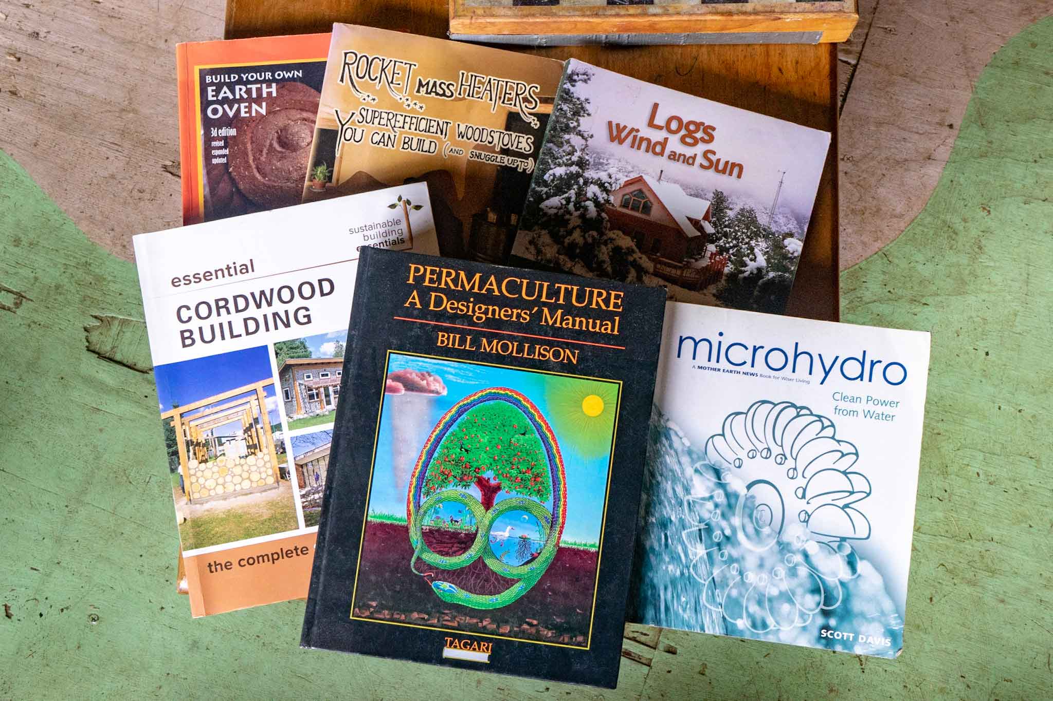 books on permaculture, hydro-power, cordwood building, and heated furniture